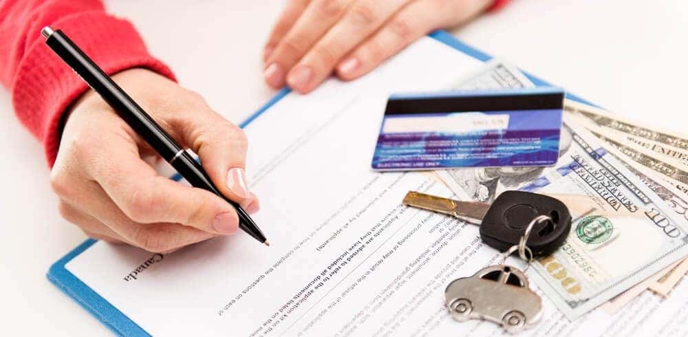 Signing Lease Paperwork at Dealership