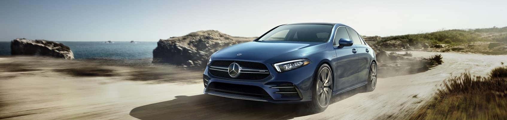 Mercedes-Benz vehicle driving on sandy beach