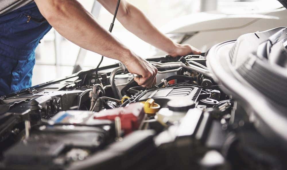 Mercedes-Benz Service Tech working on the Transmission