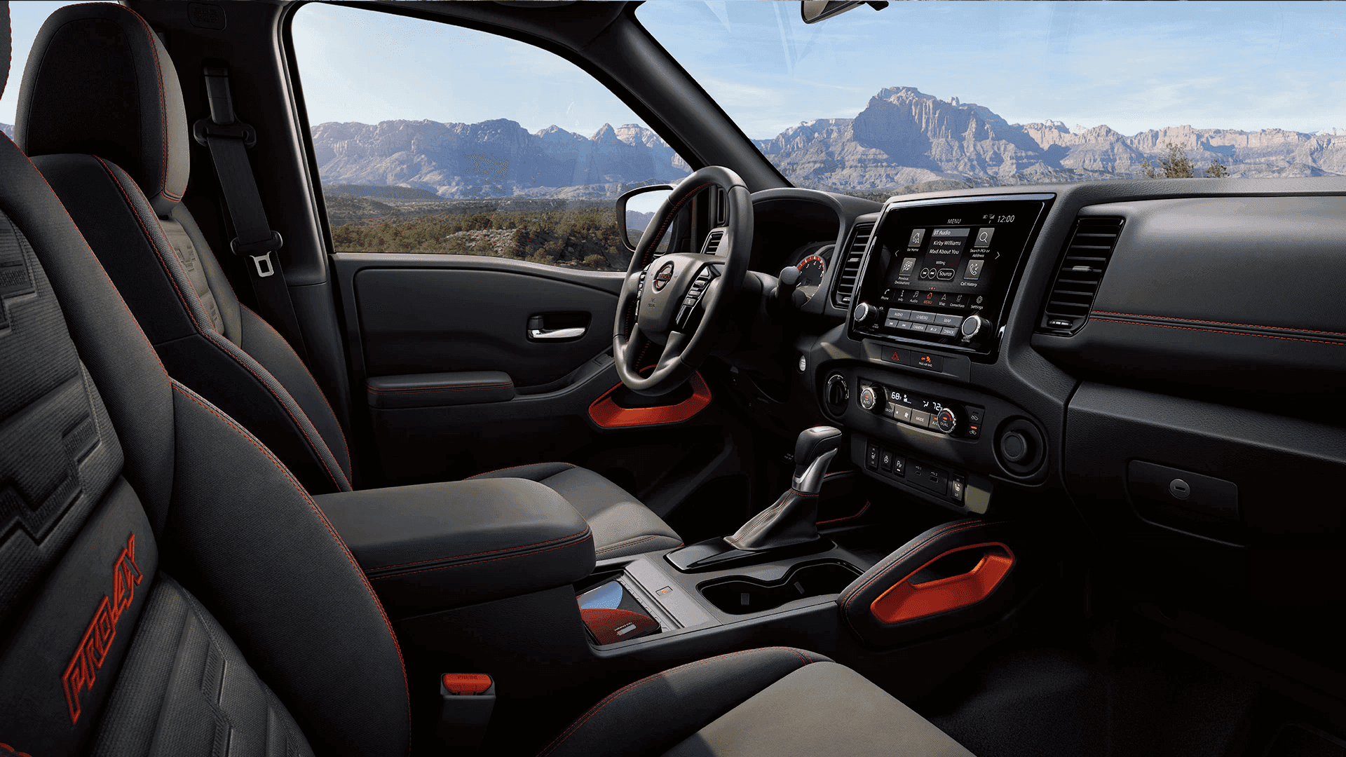 2023 Nissan Frontier interior with red accents