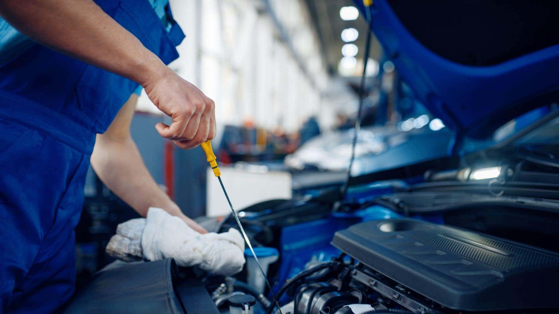 Mechanic servicing car