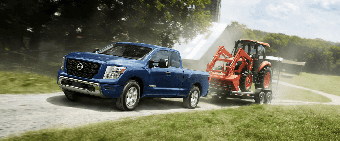 Blue 2023 Nissan Titan King Cab towing