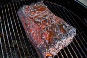 A large piece of meat on a grill