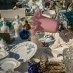 Some dishes and lamps for sale at a flea market