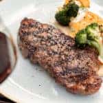 Steak Dinner With Broccoli, Mashed Potatoes, and Wine