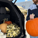 2027 GMC Acadia cargo space filled with pumpkins and fall mums near Boyertown PA