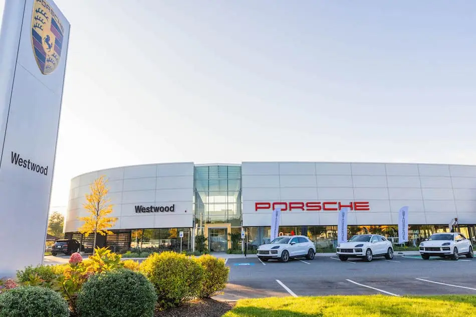 Exterior shot of a modern Porsche dealership