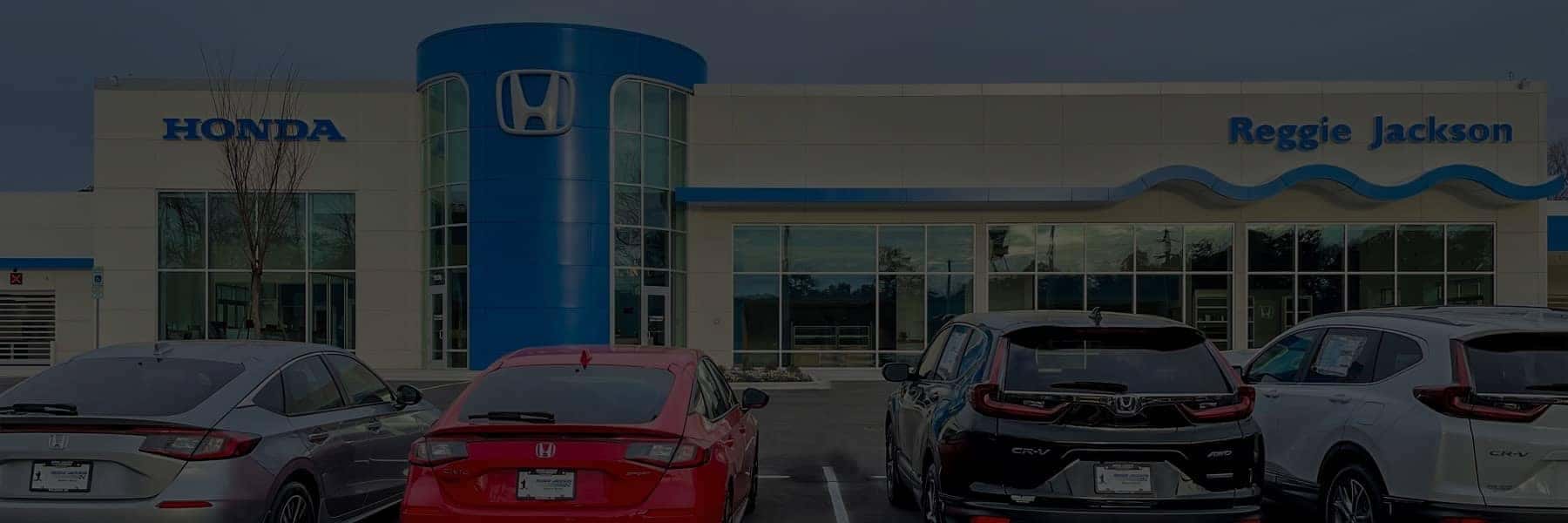 Hendrick employees standing in front of Hendrick HQ