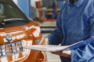 Mechanic reviewing a service quote