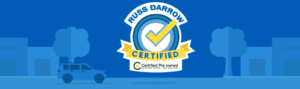 Russ Darrow certified logo against a blue backdrop with a animated city outline. 