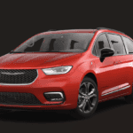 Red Hybrid Chrysler Mini Van set in front of a black back drop