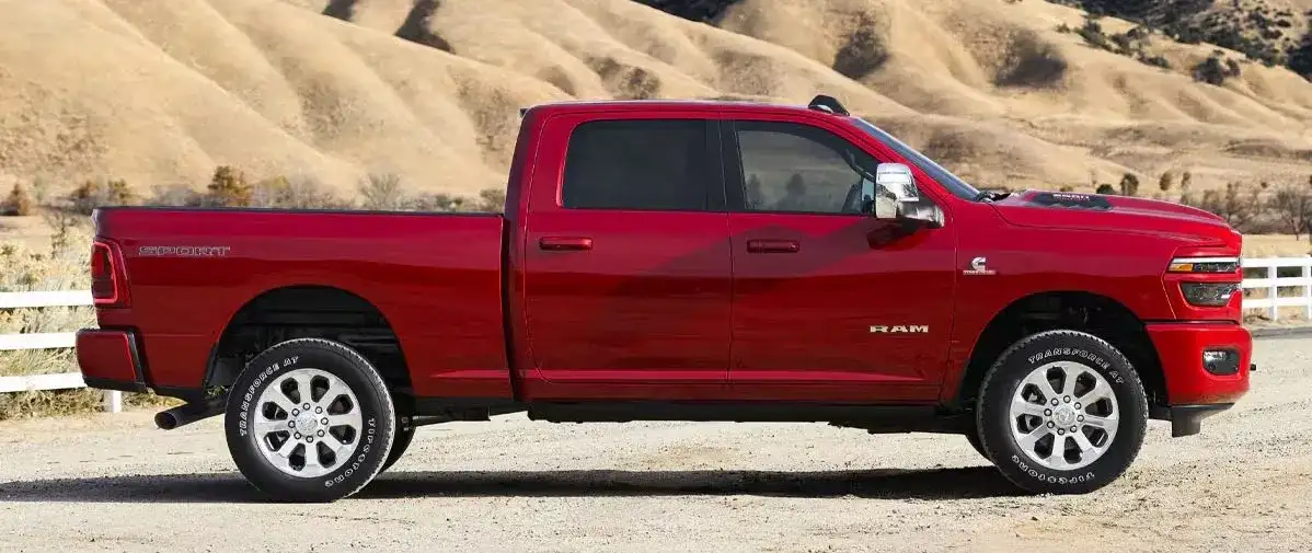 Red RAM truck parked on a desert road