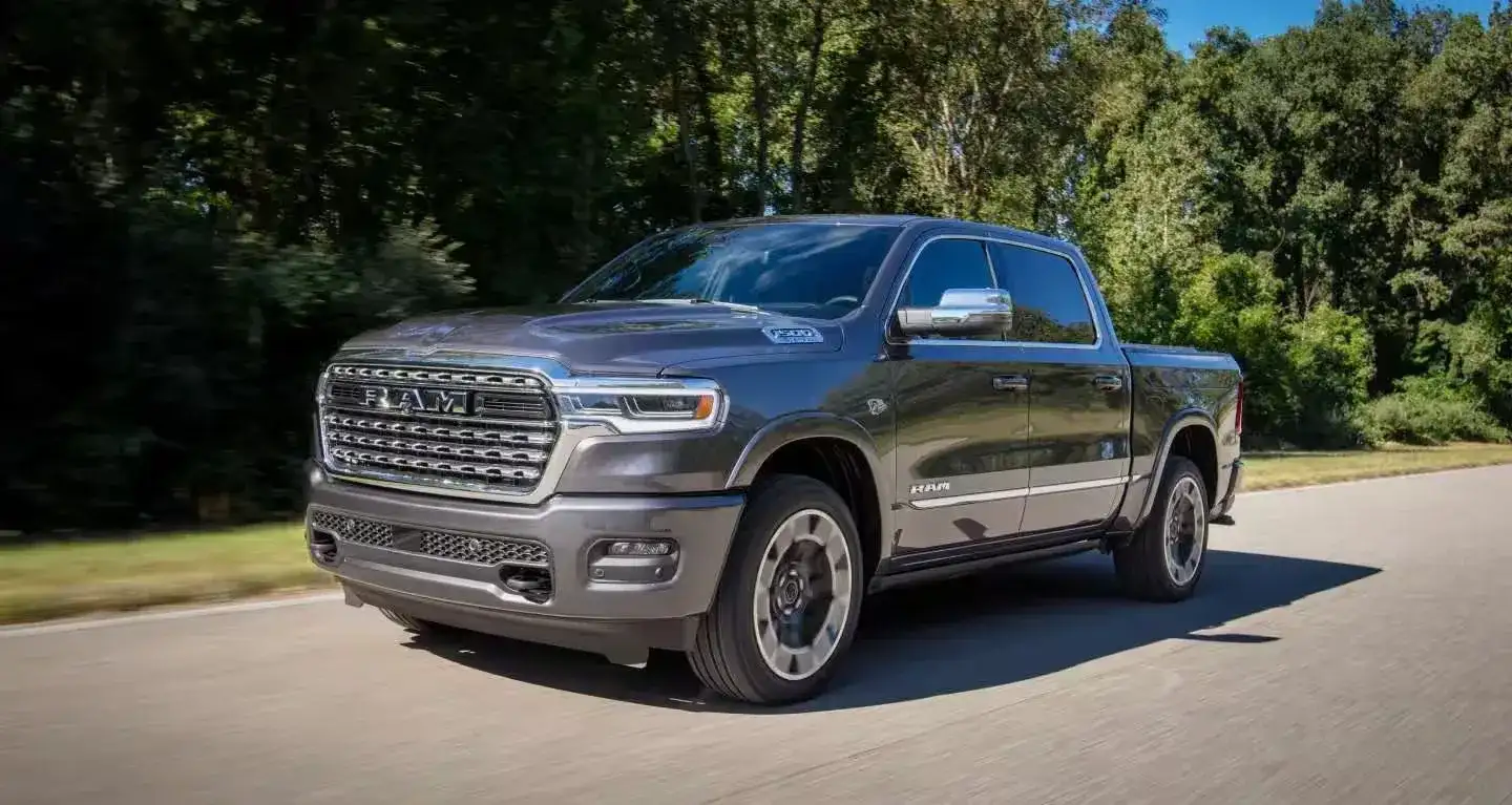 2027 RAM 1500 driving on a forest road