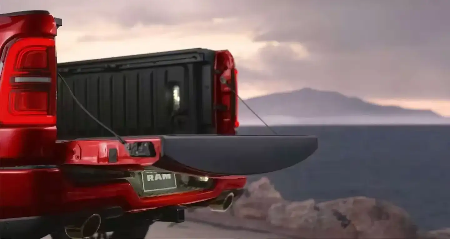 2027 RAM 1500 multifunction tailgate open at sunset
