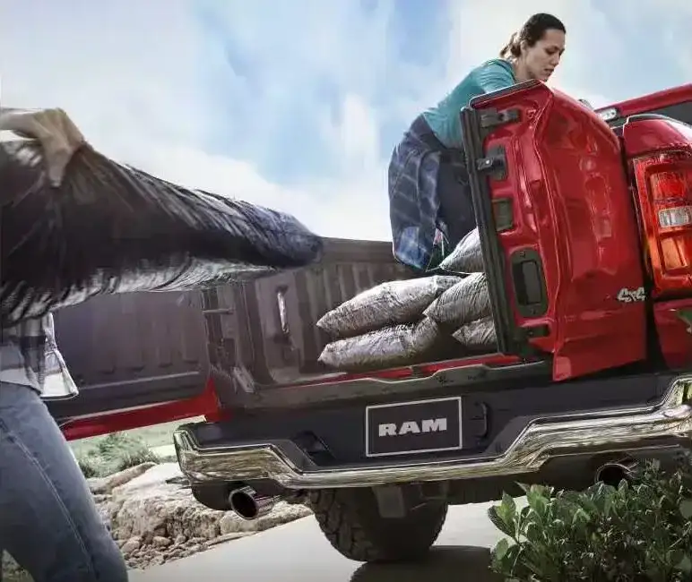 Multifunction tailgate swing-away doors open on the 2027 RAM 1500