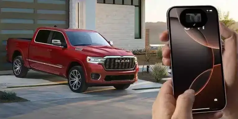 Ram Digital Key being used on a smartphone next to a red RAM 1500