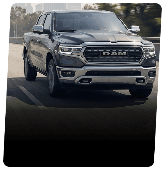Dark gray RAM 1500 hybrid pickup truck driving on a highway
