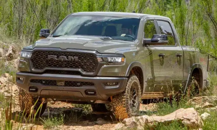 2027 RAM 1500 with lifted suspension crossing a rocky trail