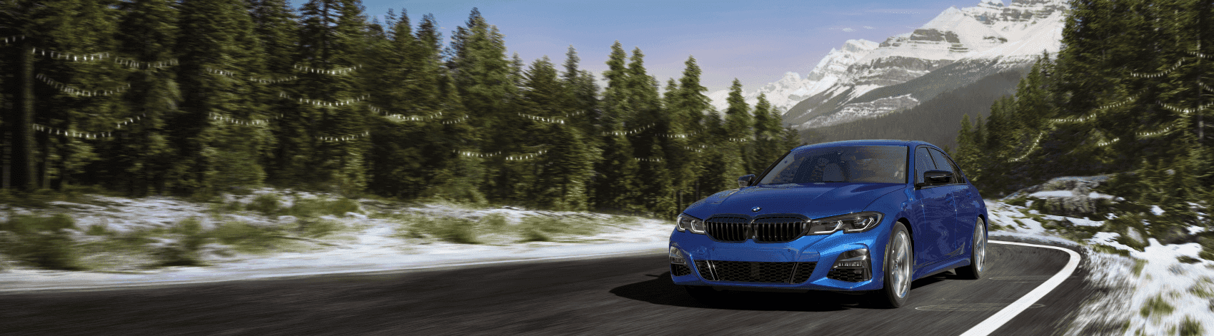 2022 BMW 3 Series among snowy mountains
