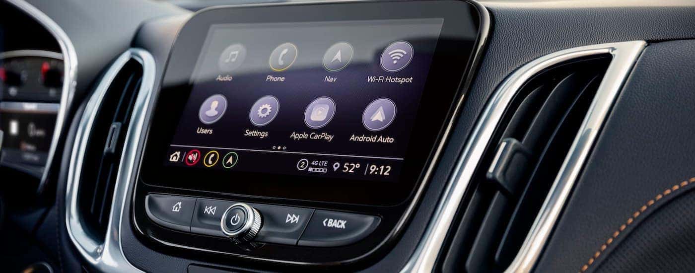 A close up shows the apps on the infotainment screen in a 2022 Chevy Equinox Premier.
