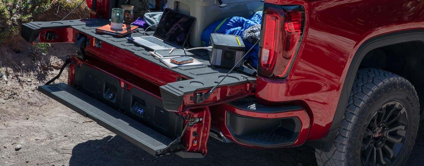 The MultiPro Tailgate is shown with a bed full of supplies on a 2022 GMC 1500 Sierra AT4-X.