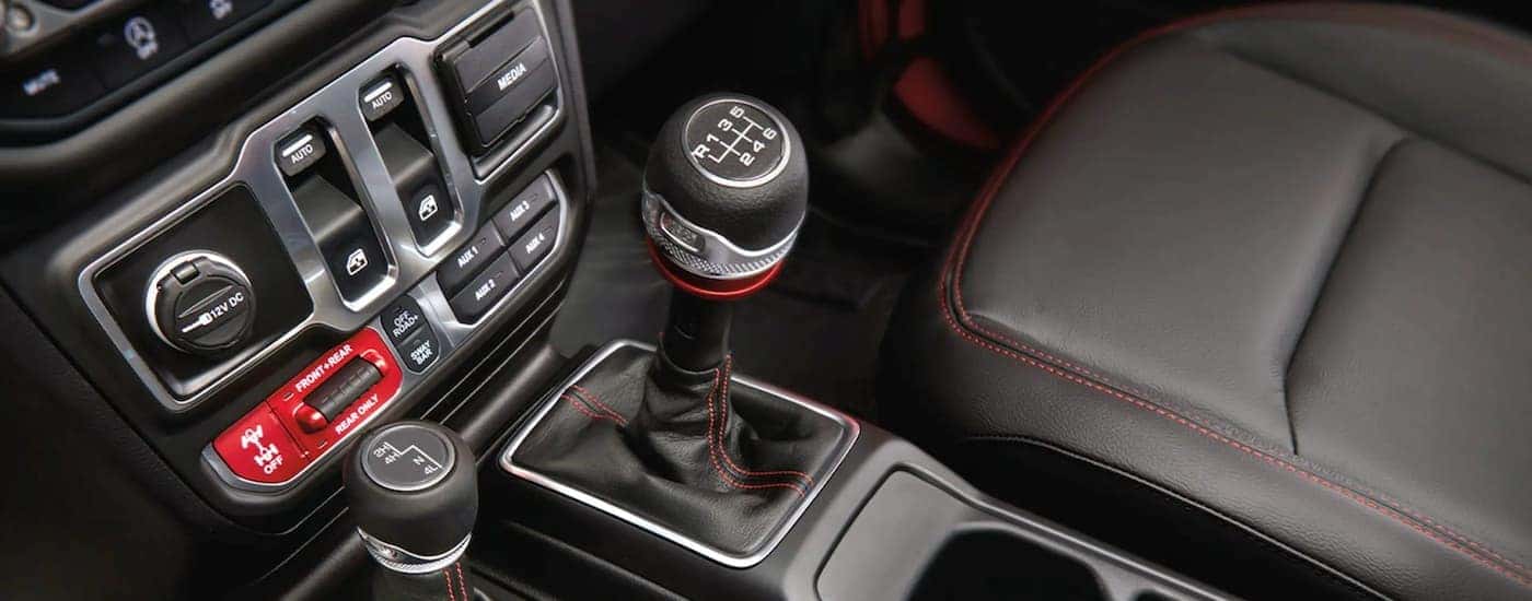 A close up shows the center console on a 2022 Jeep Wrangler Rubicon.