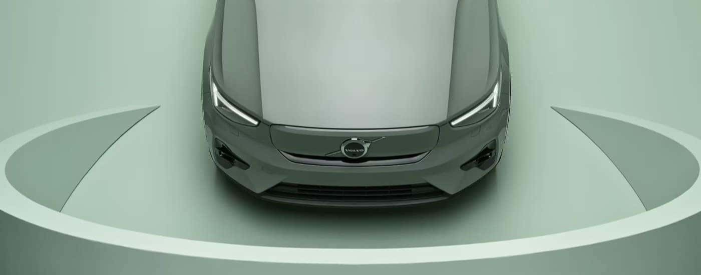 The front end of a green 2023 Volvo XC40 Recharge is shown.