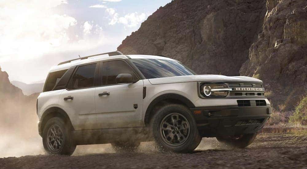 A white 2023 Ford Bronco Sport is shown from the side while off-road after leaving a dealer that has a Bronco Sport for sale near Buena Vista, CO.