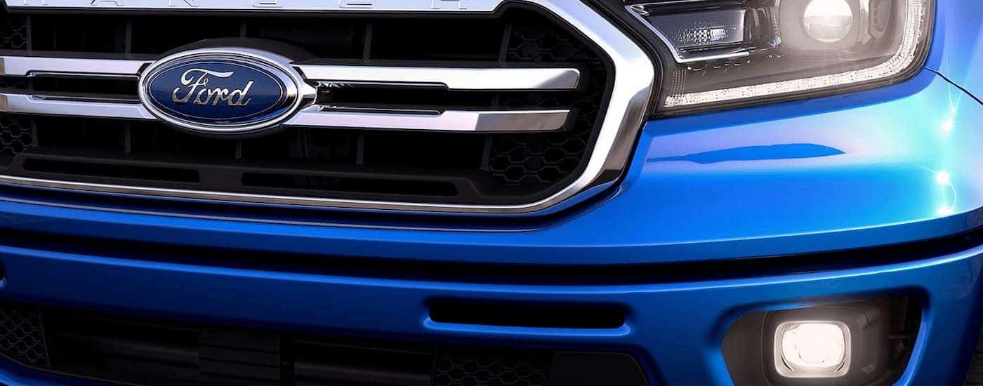 A close up of the grille on a blue 2023 Ford Ranger is shown.