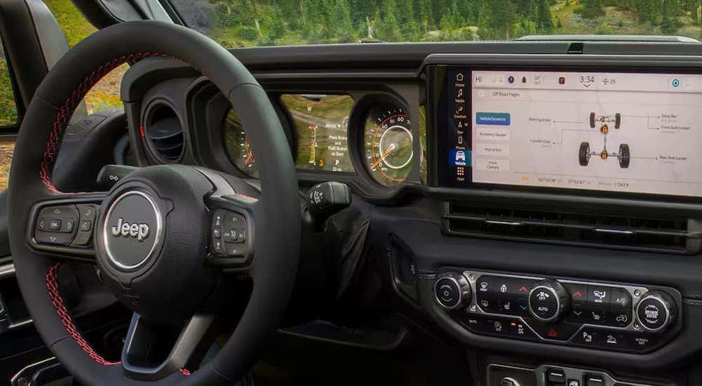 A close-up of the black dash is shown in a 2025 Jeep Gladiator.