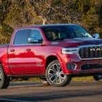 A red 2025 Ram 1500 is shown parked after visiting a Ram dealer.