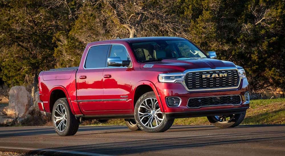 A red 2025 Ram 1500 is shown parked after visiting a Ram dealer.