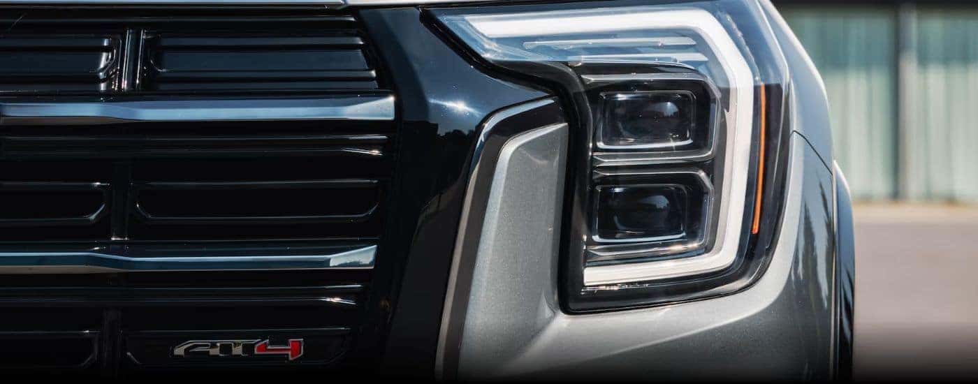 The grille of a gray 2026 GMC Terrain AT4 is shown in close-up.