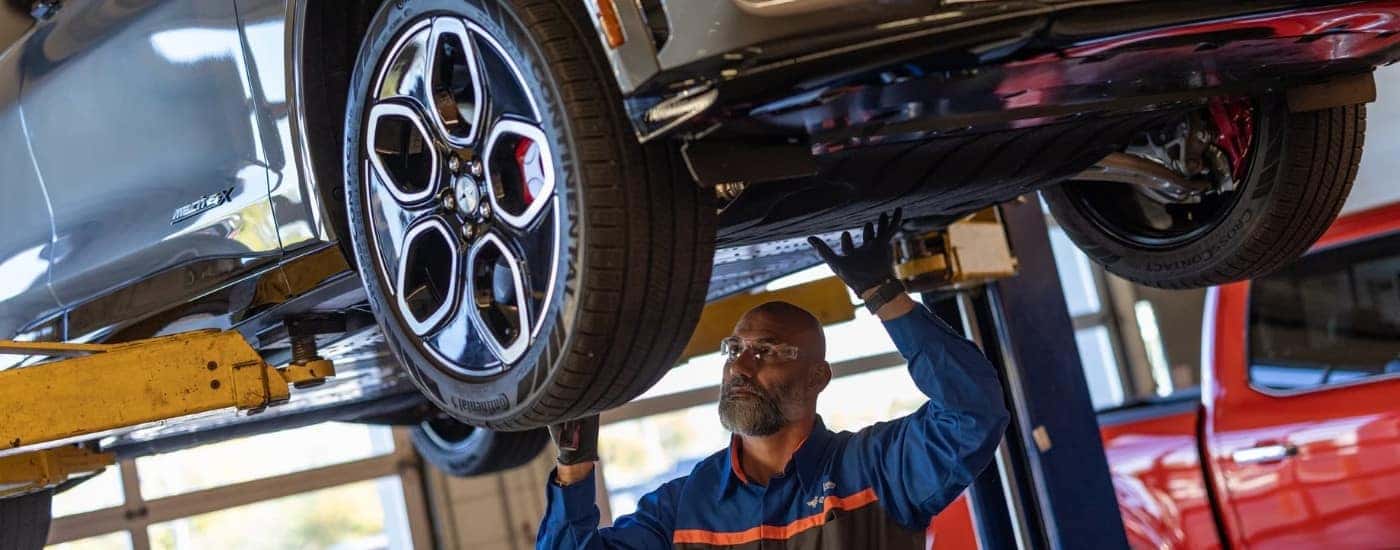 A technician performing electric car maintenance