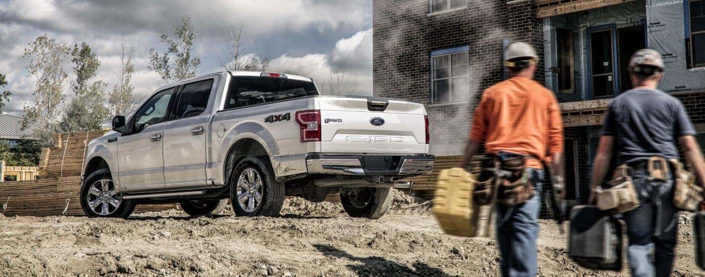A silver 2020 Ford F-150 is shown from the rear at an angle.