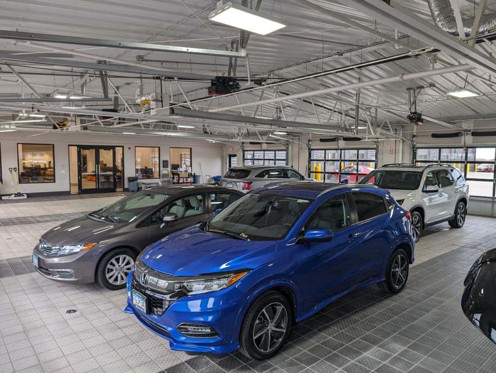 Vehicles staged inside the Tom Kadlec Auto Body facility