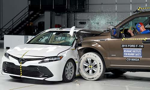a crash test of a ford truck crashing into a toyota camry