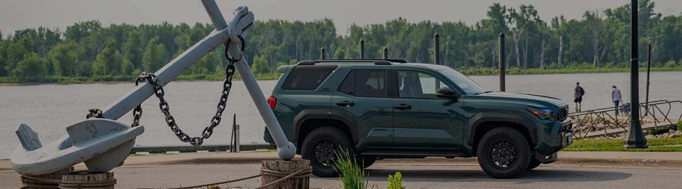 a brand new toyota 4runner from toyota of muscatine parked next to the mississippi river