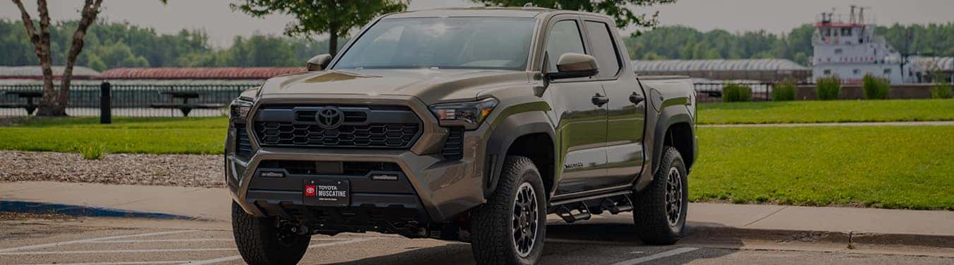 a brand new toyota tacoma from toyota of muscatine parked by the mississippi river