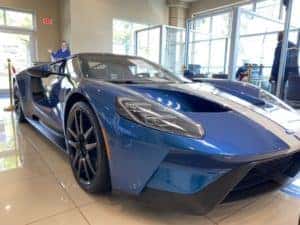 shiny blue 2019 ford gt on display in showroom