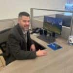 sales associate west herr sitting at desk